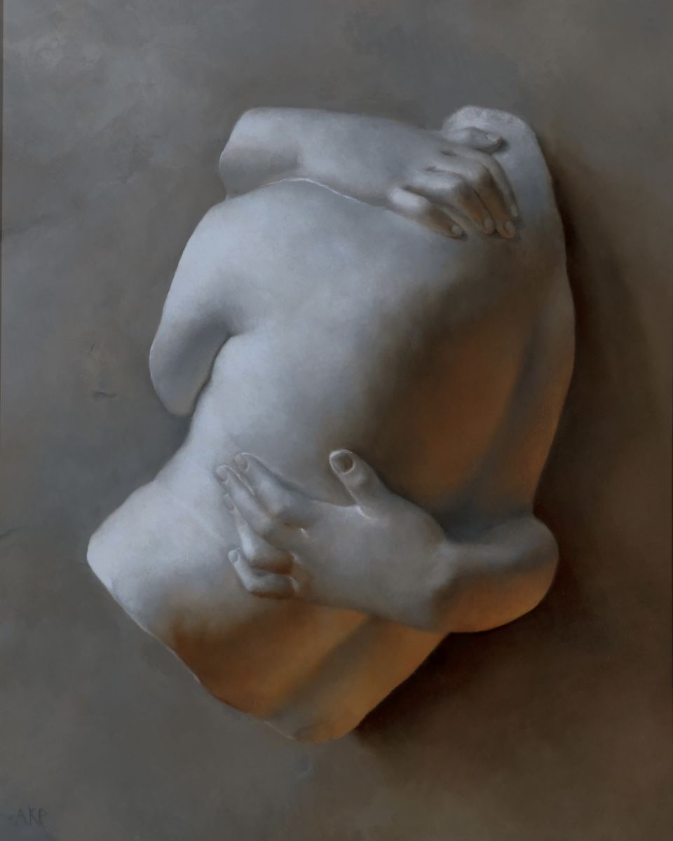 Marble sculpture of two intertwined figures, embracing closely with visible arms and backs, displayed against a textured background.